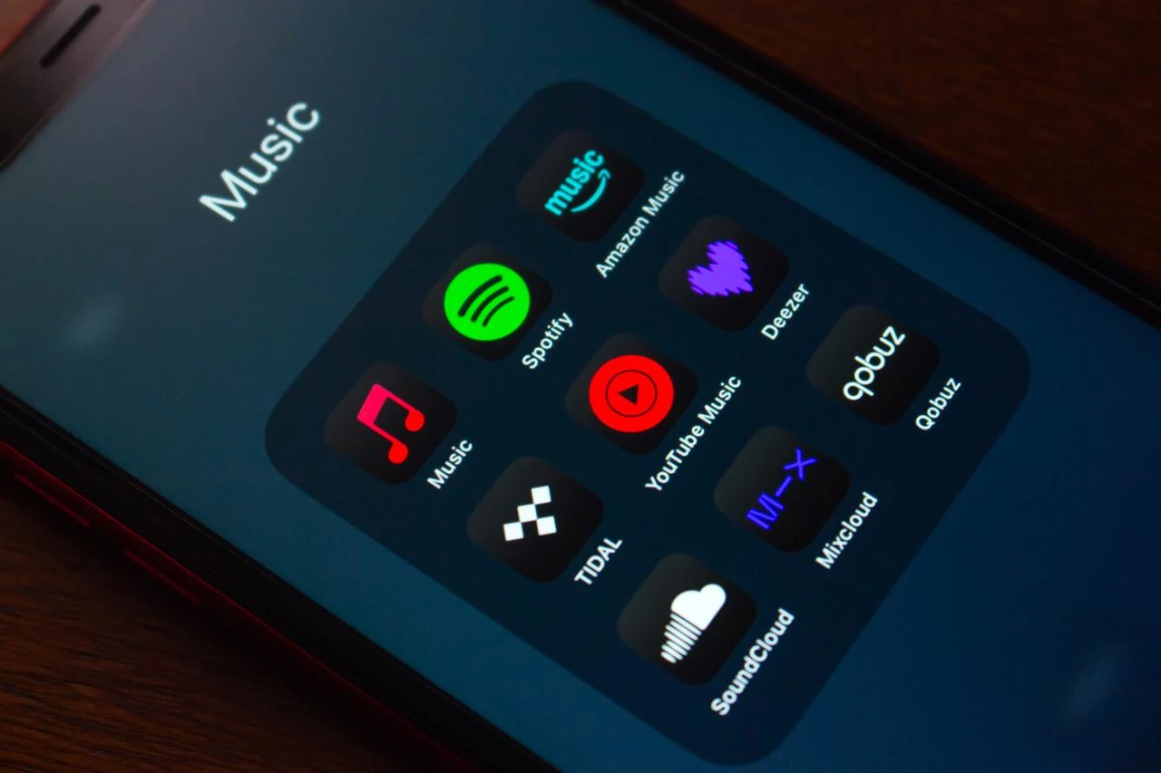 Music streaming apps, including Spotify, Amazon Music, YouTube Music, Deezer, Tidal and SoundCloud, are displayed on a smartphone screen. (Adobe Stock Photo)