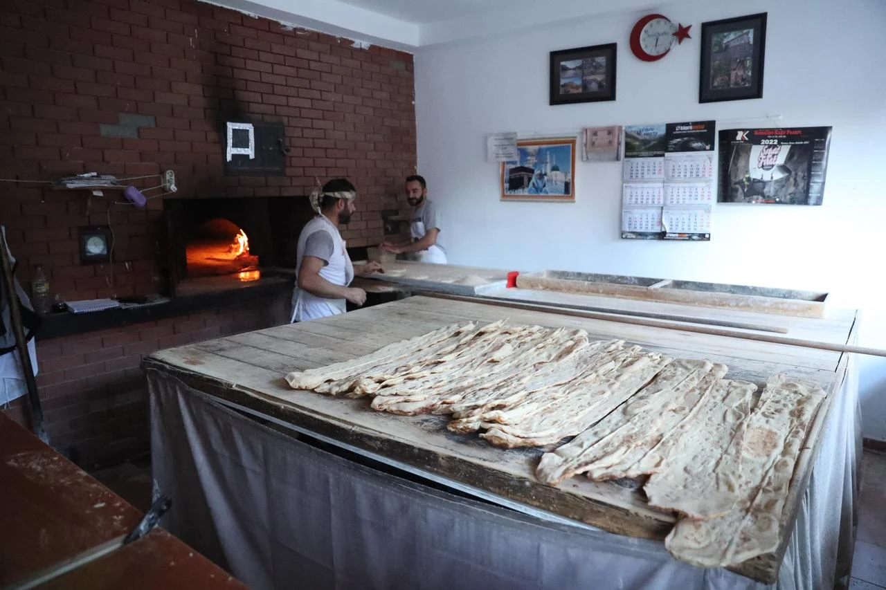 Bakery workers prepare traditional Egin bread at a bakery in Kemaliye, Erzincan, Türkiye, July 22, 2026. (AA Photo)