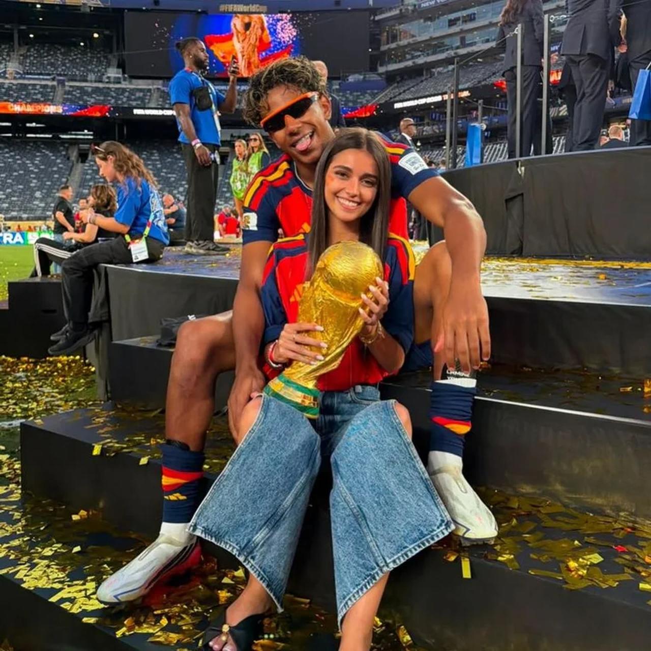 Spain star Lamine Yamal sits on the pitch with Ines Garcia after a match at the 2026 FIFA World Cup. (Photo via Goal.com)