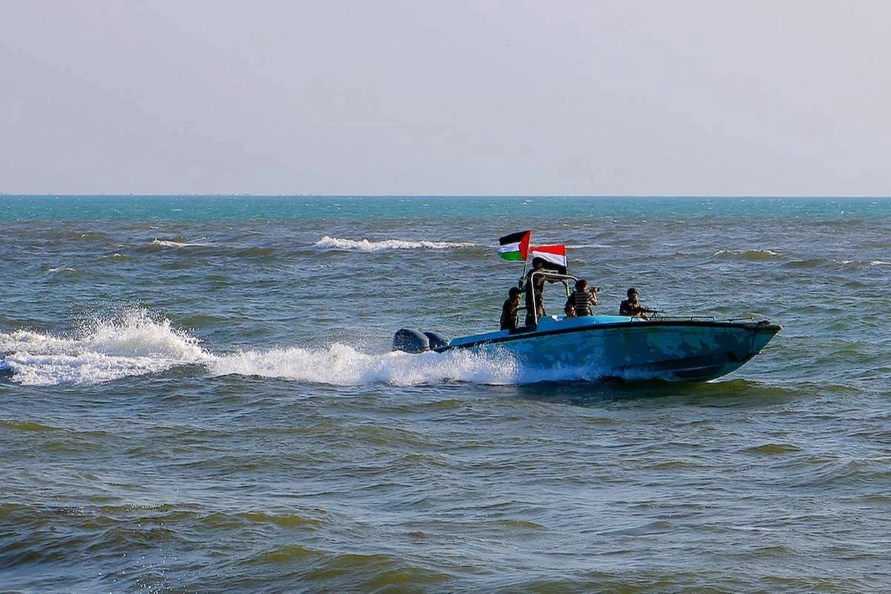 Members of the Yemeni Coast Guard affiliated with the Houthis patrol the sea as demonstrators march through the Red Sea port city of Hodeida, January 4, 2024. (AFP Photo)