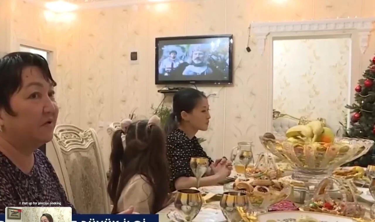 Members of a family in Kazakhstan watch a Turkish television series as they gather for an evening meal. (Photo via TRT Avaz)