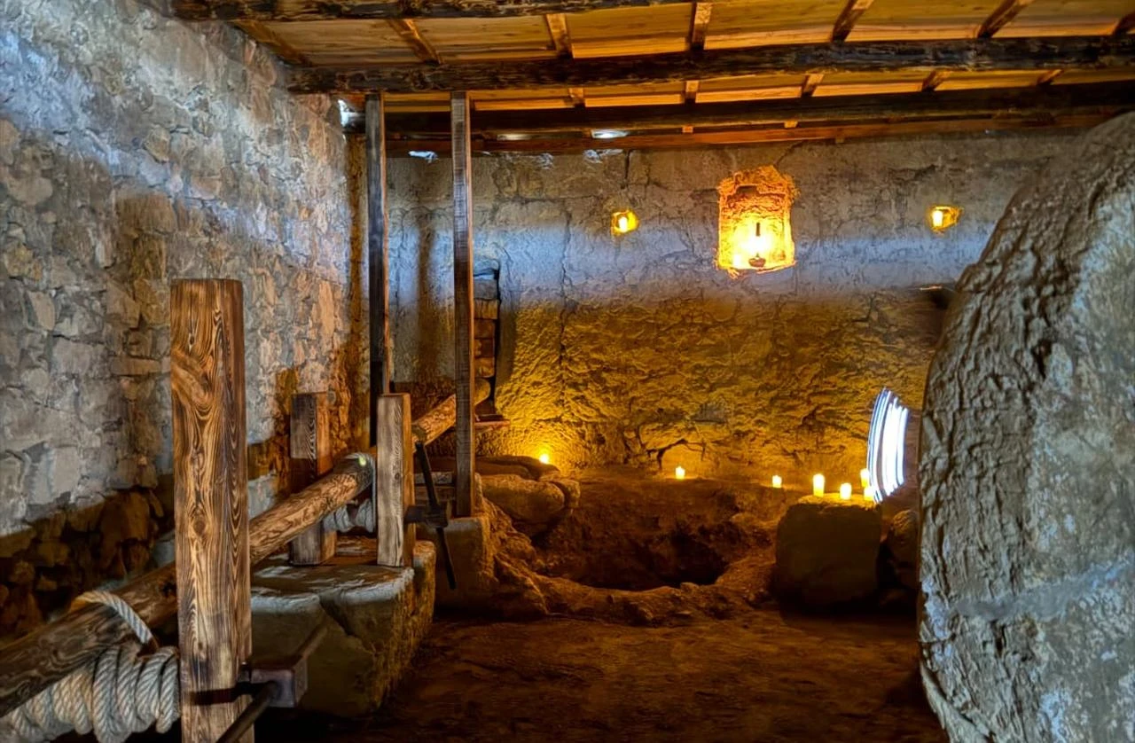 A large crushing stone stands inside the restored olive oil workshop at Syedra Ancient City in Antalya, Türkiye. (Photo via Ministry of Culture and Tourism)