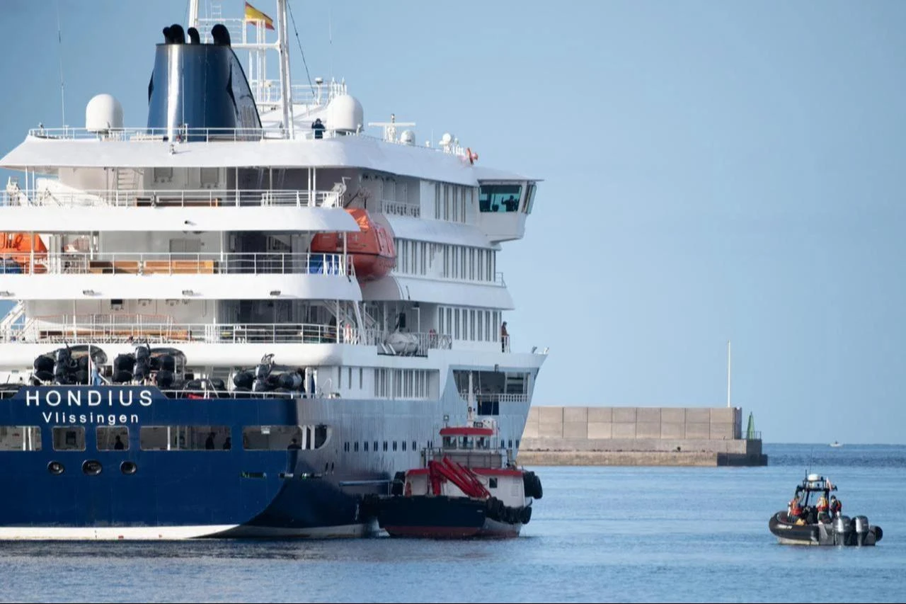 Boats approach the Dutch flagged hantavirus-stricken cruise ship MV Hondius after it arrived at the industrial port of Granadilla de Abona on the island of Tenerife in Spain's Canary Islands on May 10, 2026. (AFP Photo)