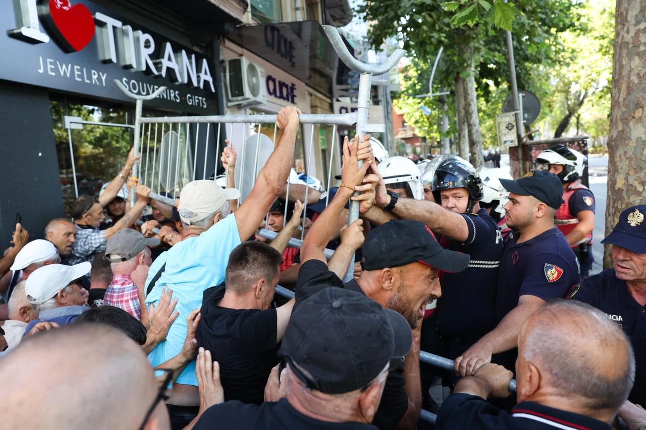 Protesters clash with police officers during a demonstration outside parliament in Tirana, on July 23, 2026 as part of a wave of protest against recent government decisions. (AFP Photo)