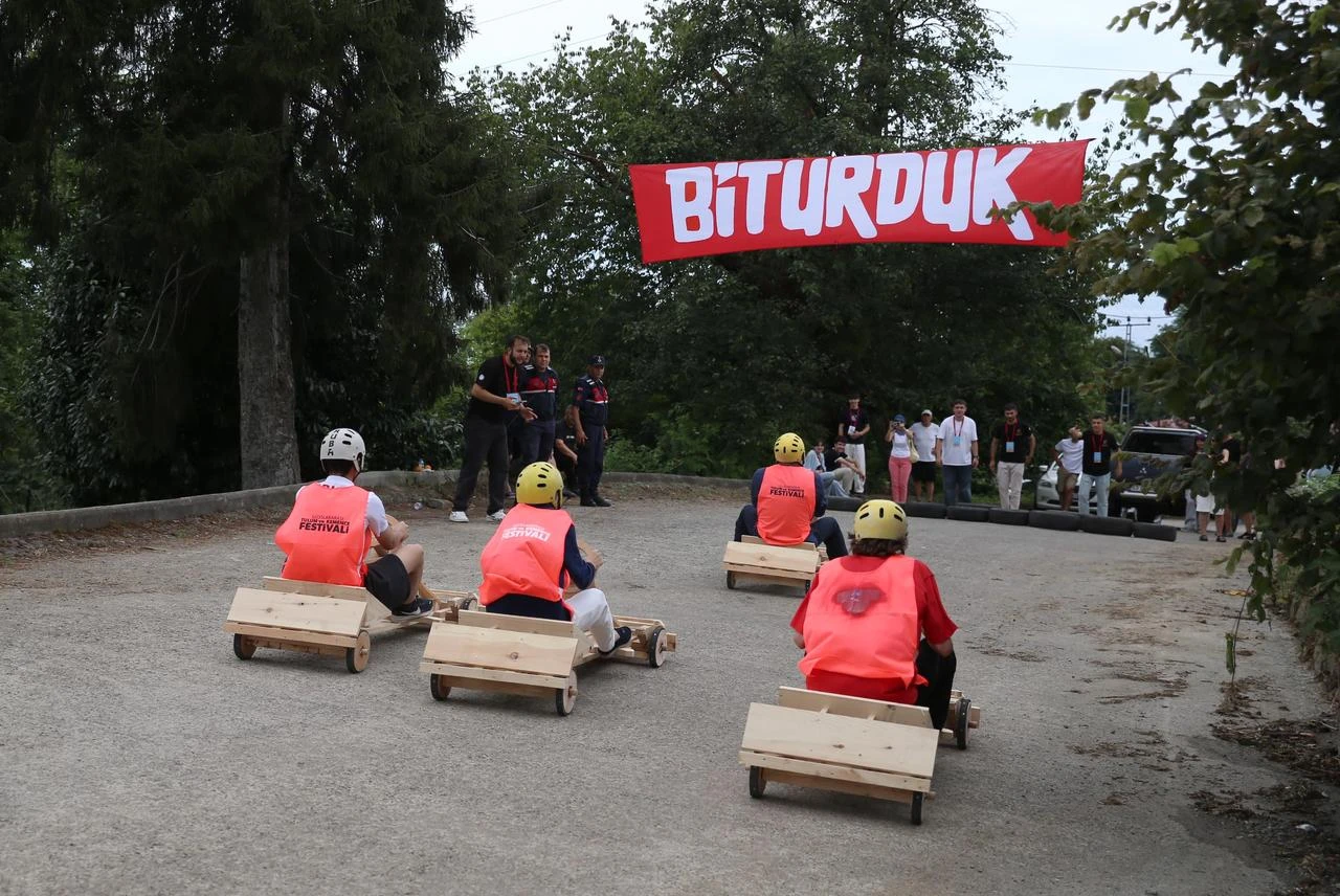 Competitors cross the finish line in traditional wooden carts during an international downhill race in Ardesen, Rize, northern Türkiye, July 22, 2026. (AA Photo)