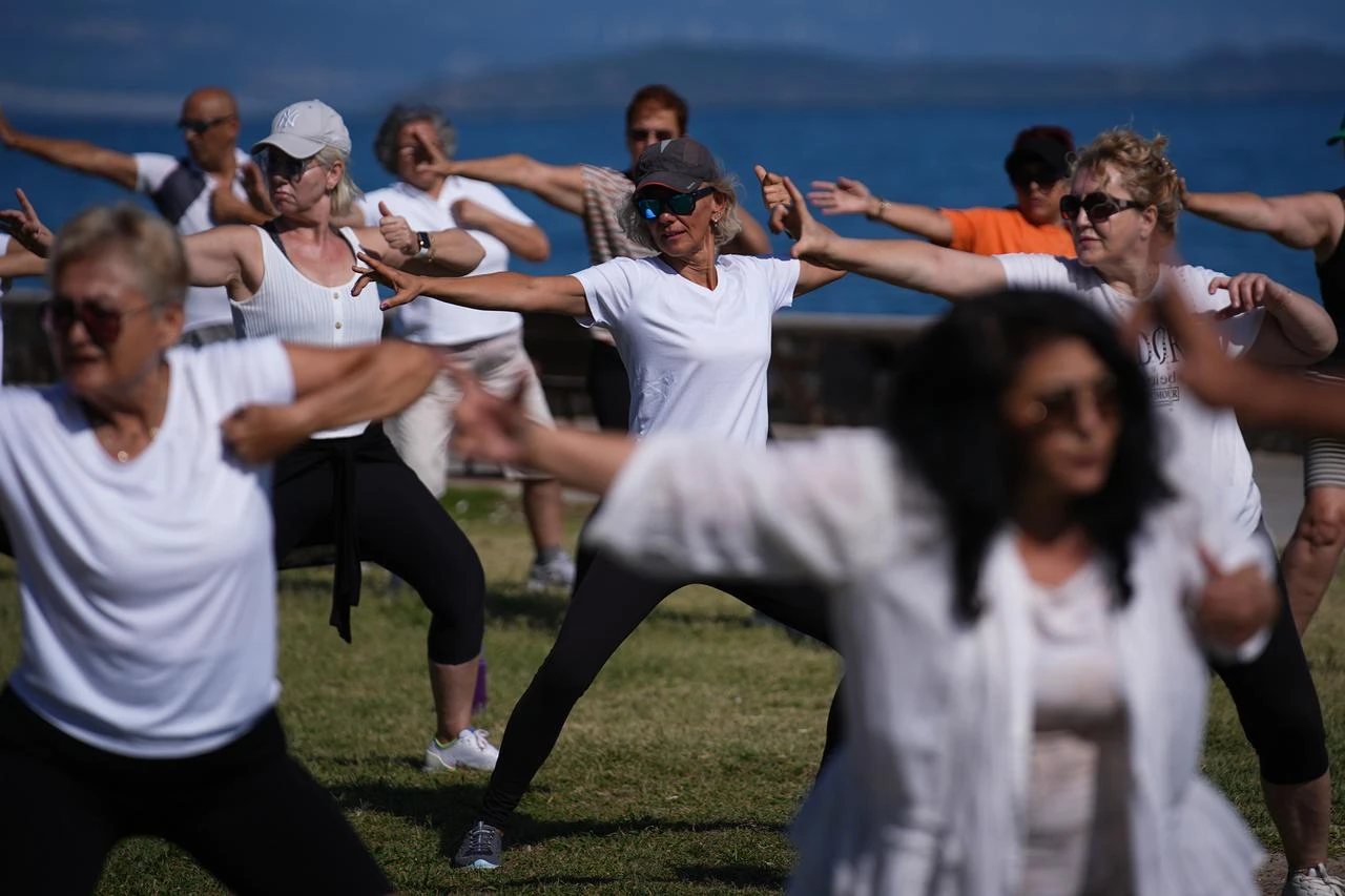 Participants practice Tai Chi during a free outdoor class along the coast in the Guzelbahce district of Izmir on July 22, 2026, in Izmir, Türkiye. (AA Photo)