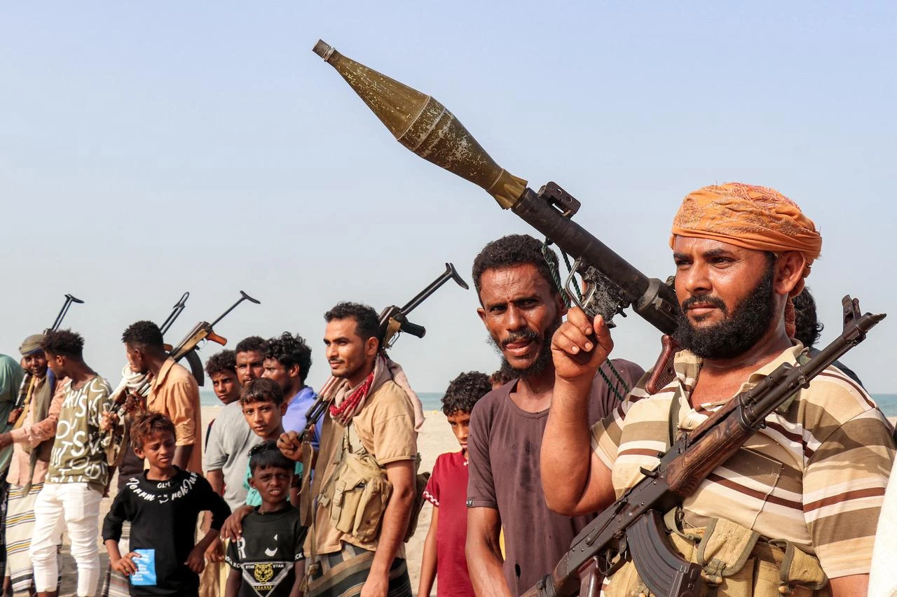 Fighters supporting the Aden-based internationally recognized Yemeni government gather during a vigil along the Red Sea shore in Khokha, in Yemen's western Hodeidah province, July 20, 2026. (AFP Photo)