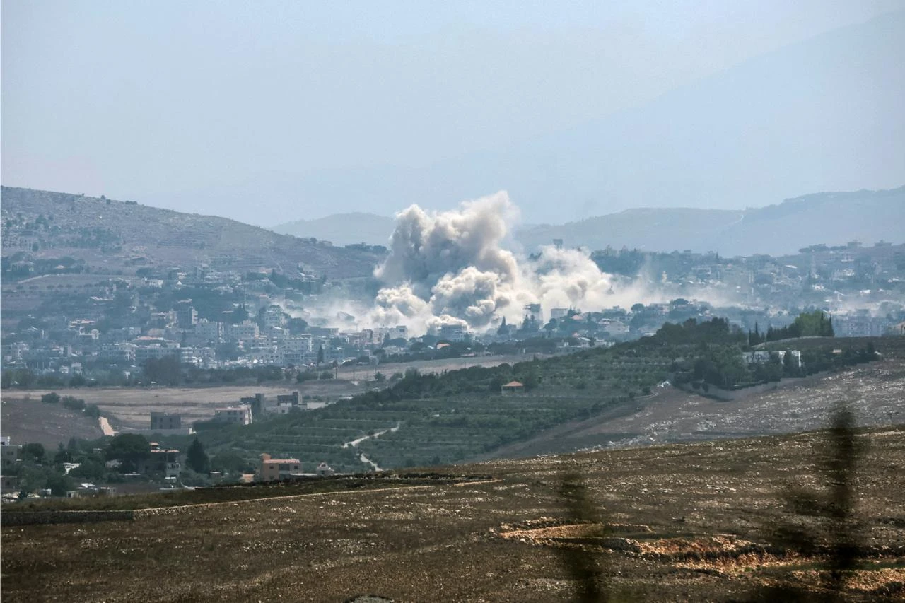 This image taken from the vicinity of the village Zawtar al-Sharqiyah in southern Lebanon, shows smoke rising from the site of an explosion carried out by the Israeli military, in the village of Kfar Tibnit on July 23, 2026. (AFP Photo)