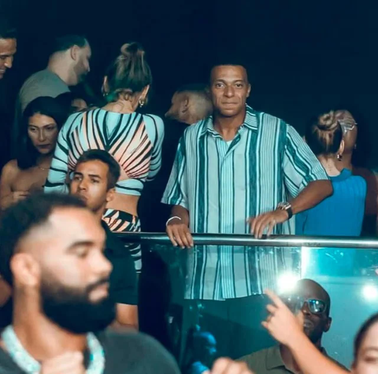French footballer Kylian Mbappe stands in a private area of a nightclub in Miami during his post-World Cup break. (Photo via Haberler.com)