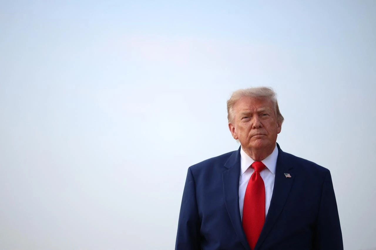 U.S. President Donald Trump looks to reporters after getting off Air Force One on July 22, 2026 at Joint Base Andrews, Maryland. (AFP Photo)