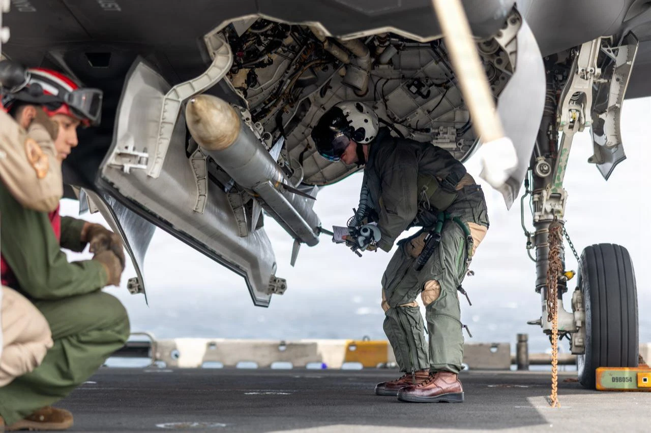 A U.S. Marine inspects ordnance on an F-35B Lightning II during flight operations aboard the Wasp-class amphibious assault ship USS Boxer (LHD 4), July 8, 2026. (Photo via U.S. Marine Corps)