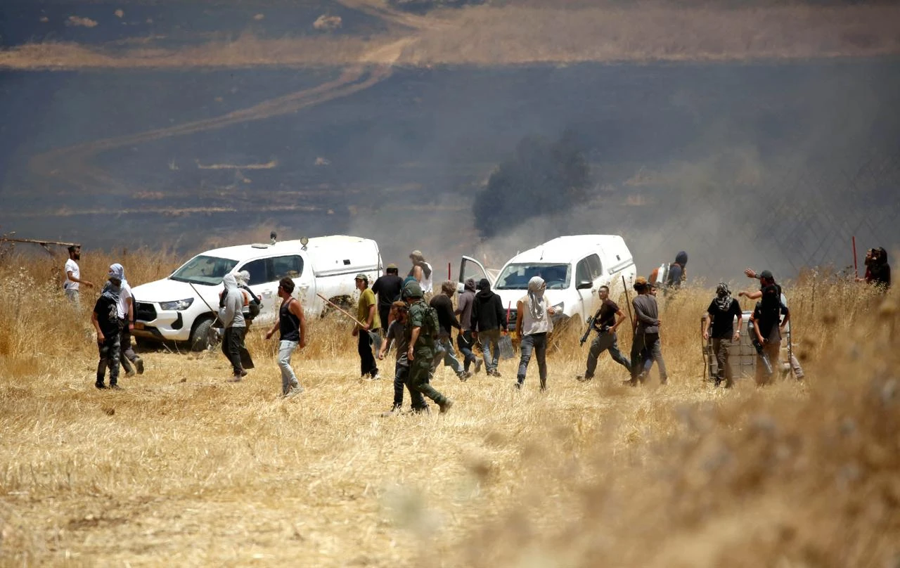 Israeli settlers attack Palestinian farmers and set fire to agricultural lands in the town of Beit Furik, east of Nablus in West Bank, Palestine, July 23, 2026. (AA Photo)
