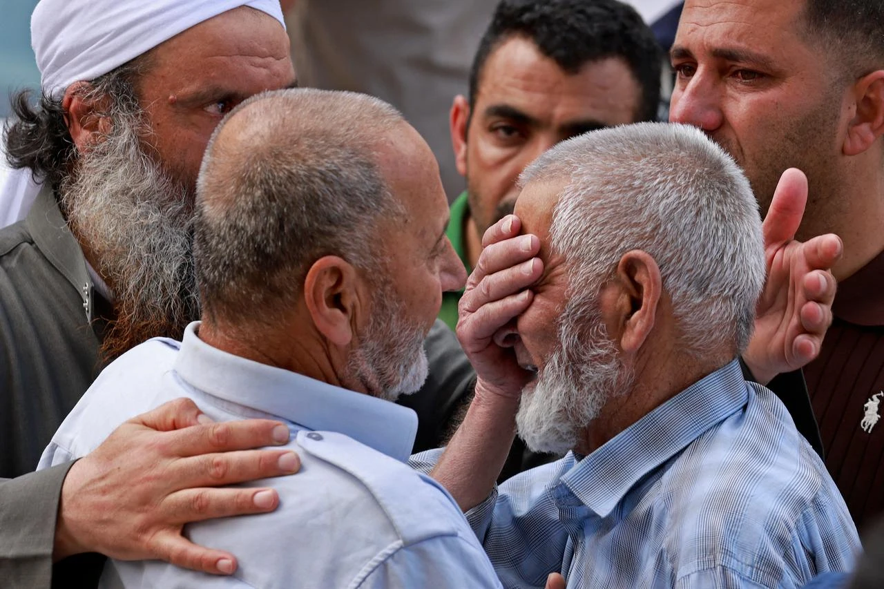 Family members of one of the four Palestinians who died in the clashes, weeps outside a hospital in Nablus, in the occupied West Bank on July 24, 2026. (AFP Photo)