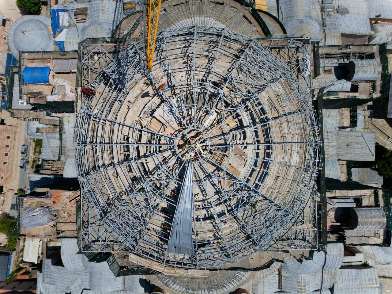 An aerial view shows the temporary steel structure built over Hagia Sophia’s main dome as part of ongoing restoration and strengthening work. (AA Photo)