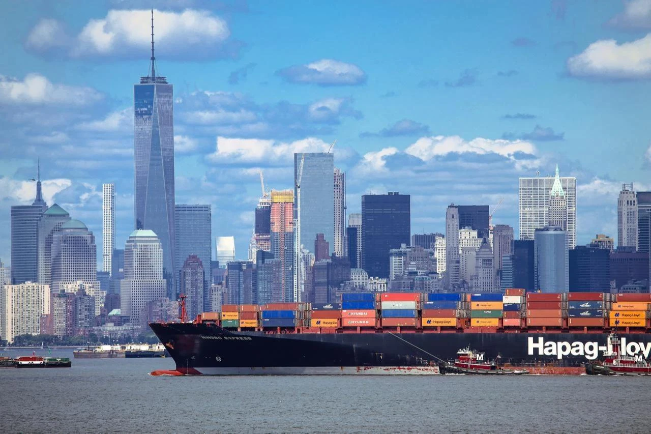 A large Hapag-Lloyd container ship carrying import cargo enters New York Harbor, US, March 27, 2025. (Adobe Stock Photo)