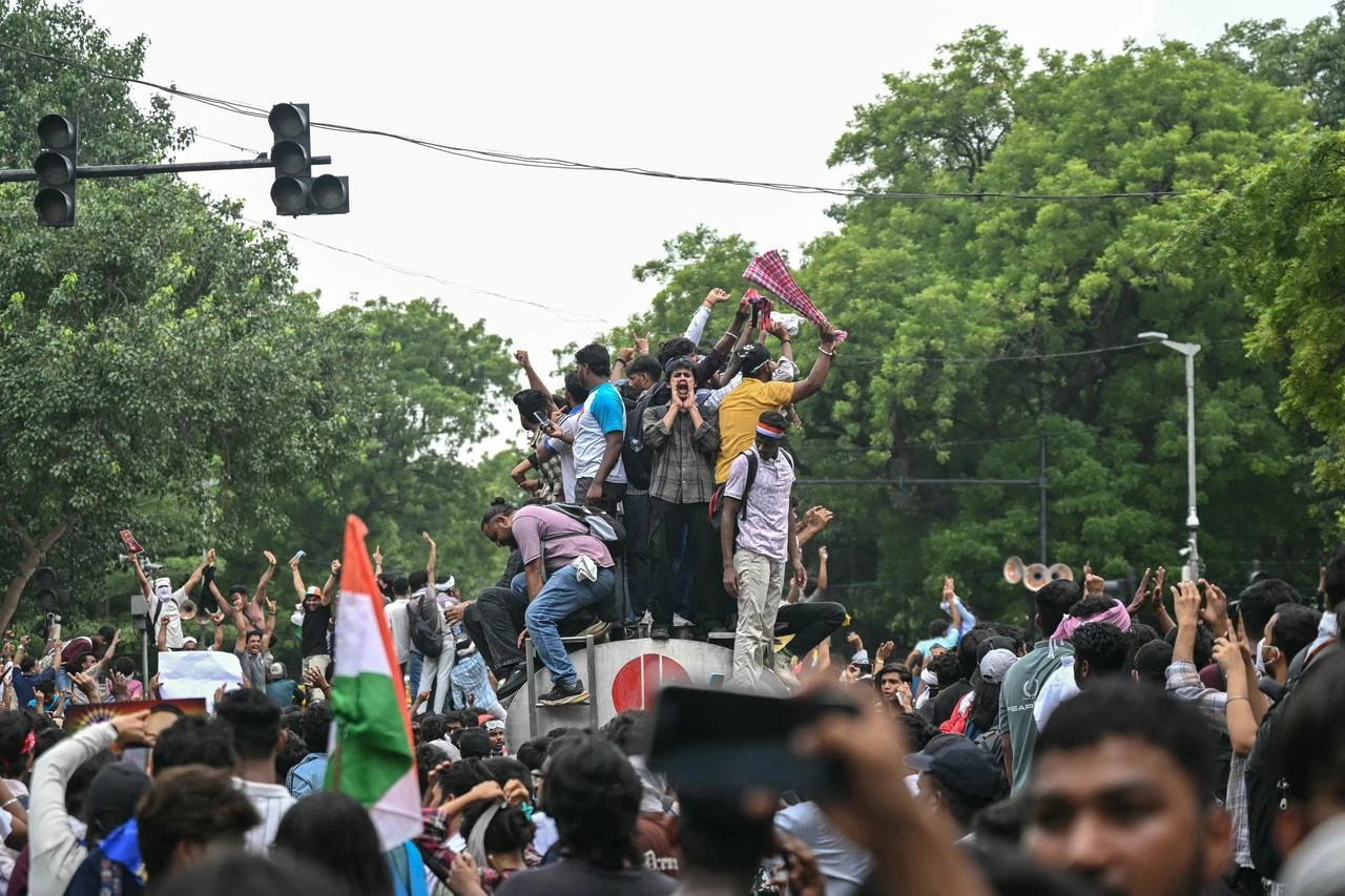 Cockroach Janta Party (CJP) supporters celebrate the resignation of India's Education Minister Dharmendra Pradhan, at Jantar Mantar in New Delhi on July 25, 2026 amid the ongoing protests over alleged NEET exam irregularities. (AFP Photo)