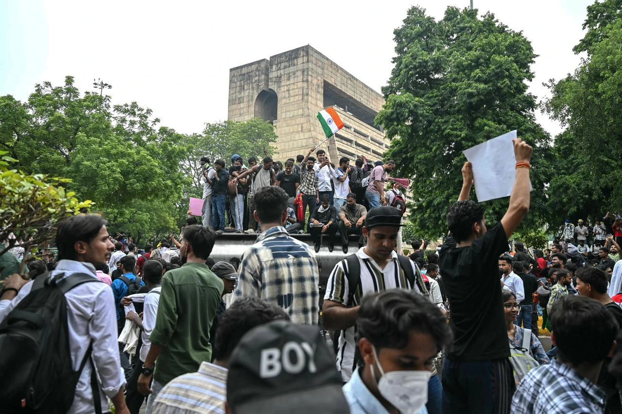 Cockroach Janta Party (CJP) supporters celebrate the resignation of India's Education Minister Dharmendra Pradhan, at Jantar Mantar in New Delhi on July 25, 2026 amid the ongoing protests over alleged NEET exam irregularities. (AFP Photo)