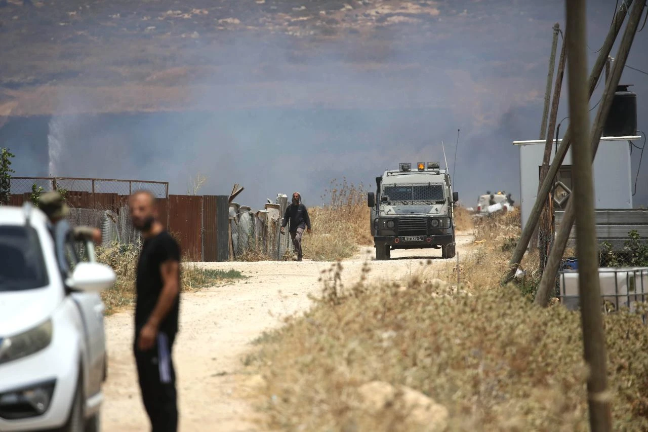 Israeli forces deploy to the area as Israeli settlers attack Palestinian farmers and set fire to agricultural lands in the town of Beit Furik, east of Nablus in West Bank, Palestine on July 23, 2026. (AA Photo)
