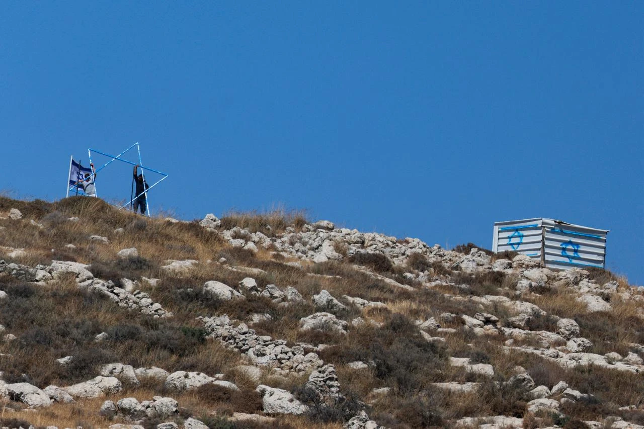 Israeli settlers build a new outpost at the Palestinian village of Azmut in the occupied West Bank, July 17, 2026. (AFP Photo)