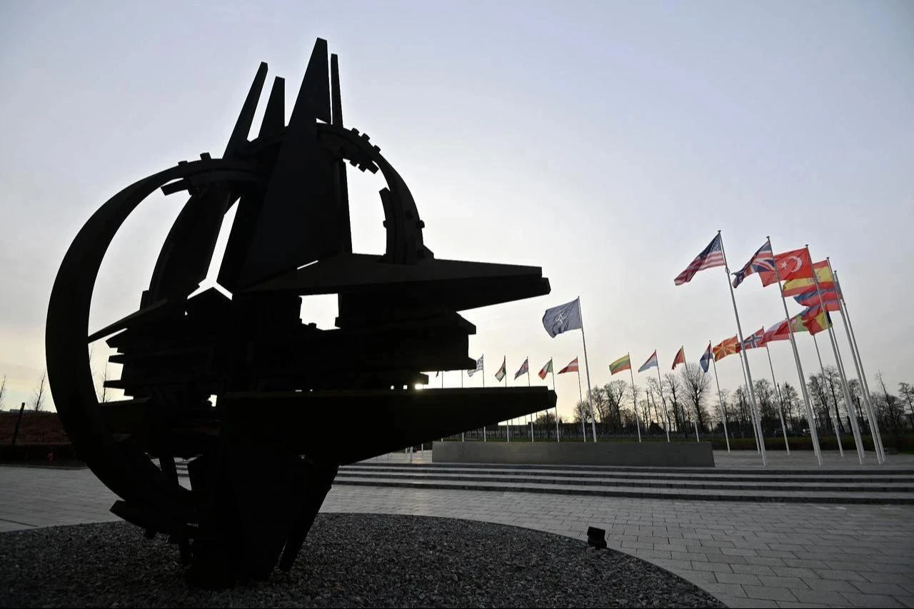 The national flags of NATO member countries fly outside the organization's headquarters in Brussels, January 10, 2023. (AFP Photo)
