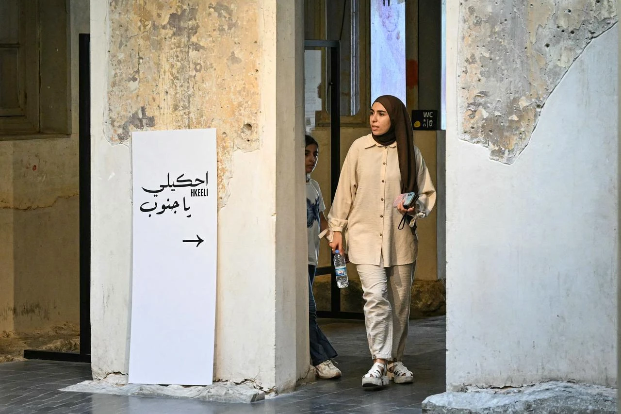A visitor tours "Hkeeli ya Jnoub" (tell me, O south) exposition, which aims to preserve the memory of villages destroyed by Israel in southern Lebanon, in Beirut on July 17, 2026. (AFP Photo)