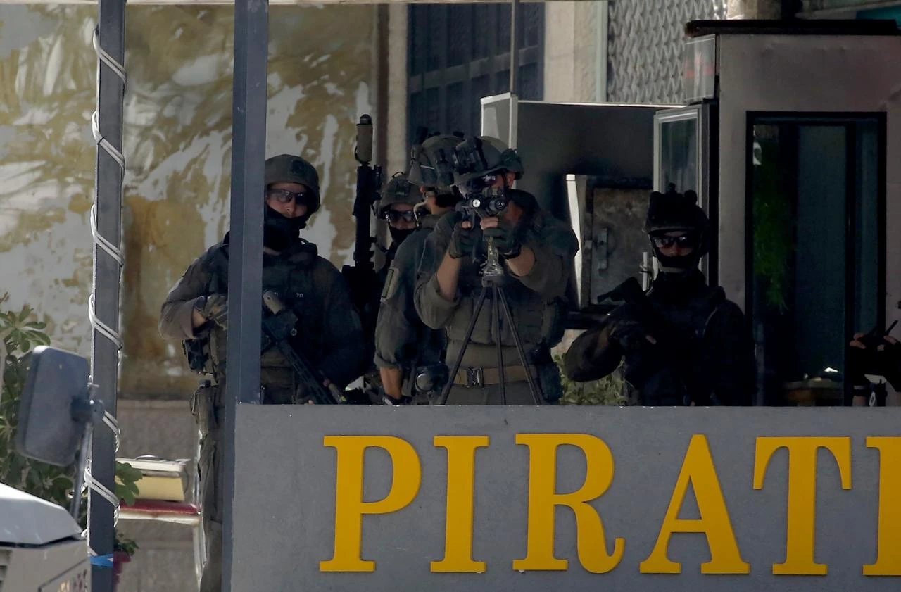 Israeli soldiers block the road leading to Nablus Hospital, after raiding the hospital and detaining a wounded Palestinian, and his sibling in Nablus, West Bank, Palestine on July 24, 2026. (AA Photo)
