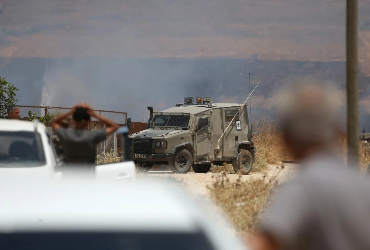 Israeli forces deploy to the area as Israeli settlers attack Palestinian farmers and set fire to agricultural lands in the town of Beit Furik, east of Nablus in West Bank, Palestine on July 23, 2026. (AA Photo)