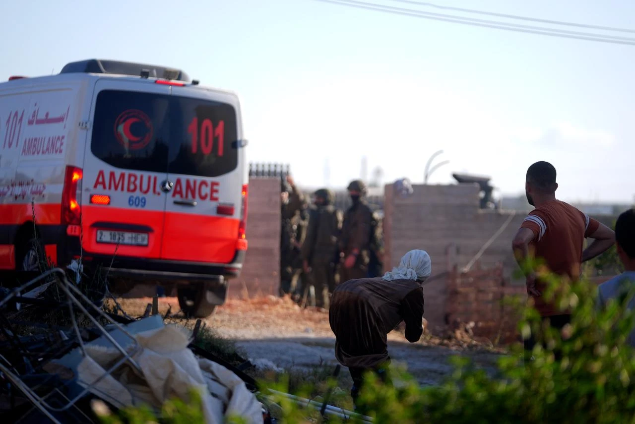 Firefighting and emergency health teams arrive to the are as dozens of Israelis, under the protection of the Israeli army, raid the town of Sarra, affiliated with the city of Nablus, West Bank, Palestine on July 24, 2026. (AA Photo)