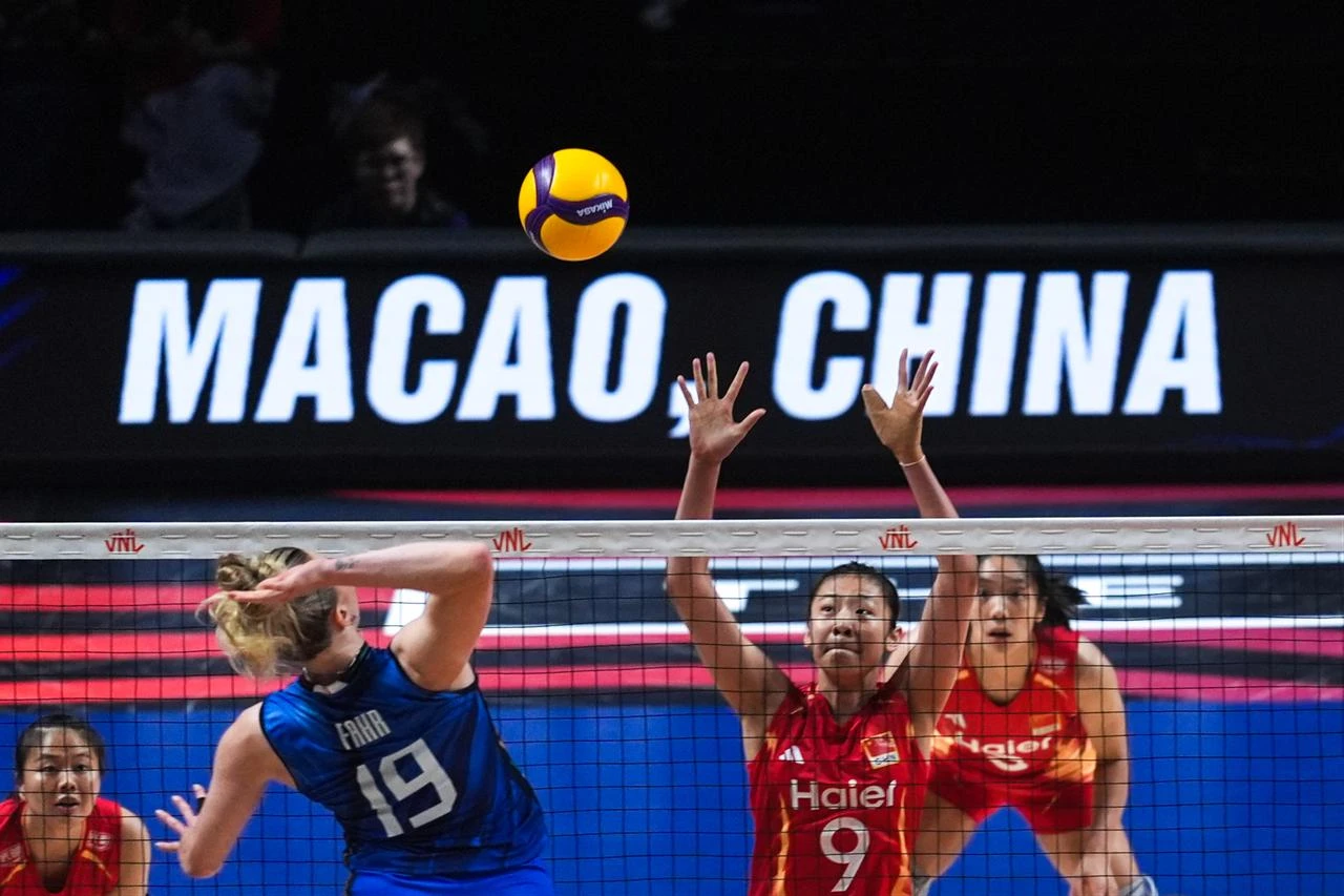 Italian player Sarah Luisa Fahr (19) attacks against China’s Aoqian Wang (9) during the 2026 FIVB Women’s Volleyball Nations League final in Macao, China, July 26, 2026. (AA Photo)
