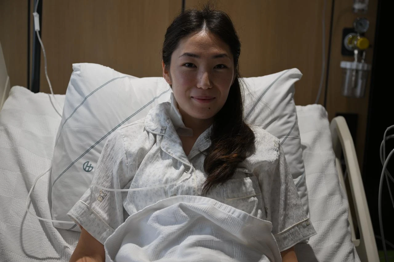 Zarina Narynbek rests in a hospital bed after undergoing treatment for pheochromocytoma in Türkiye, July 26, 2026. (AA Photo)
