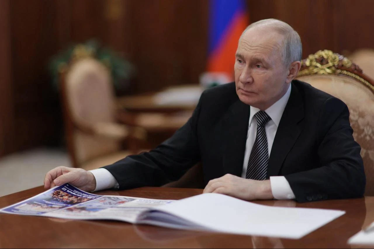In this pool photograph distributed by the Russian state agency Sputnik, Russia's President Vladimir Putin meets with the Kursk region governor in Moscow, June 30, 2026. (Photo via Sputnik/AFP)