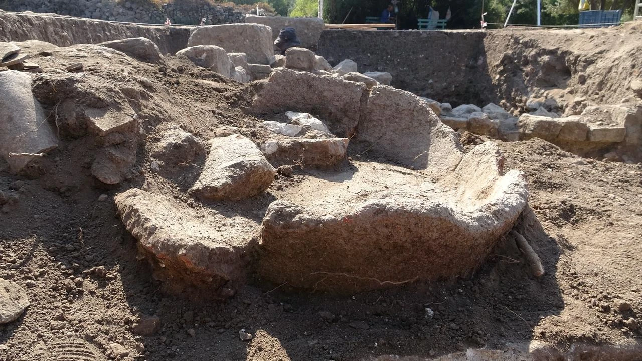 A 1,500-year-old stone mortar uncovered at the Apollo Smintheus Sanctuary in Canakkale, northwestern Türkiye, July 2026. (IHA Photo)