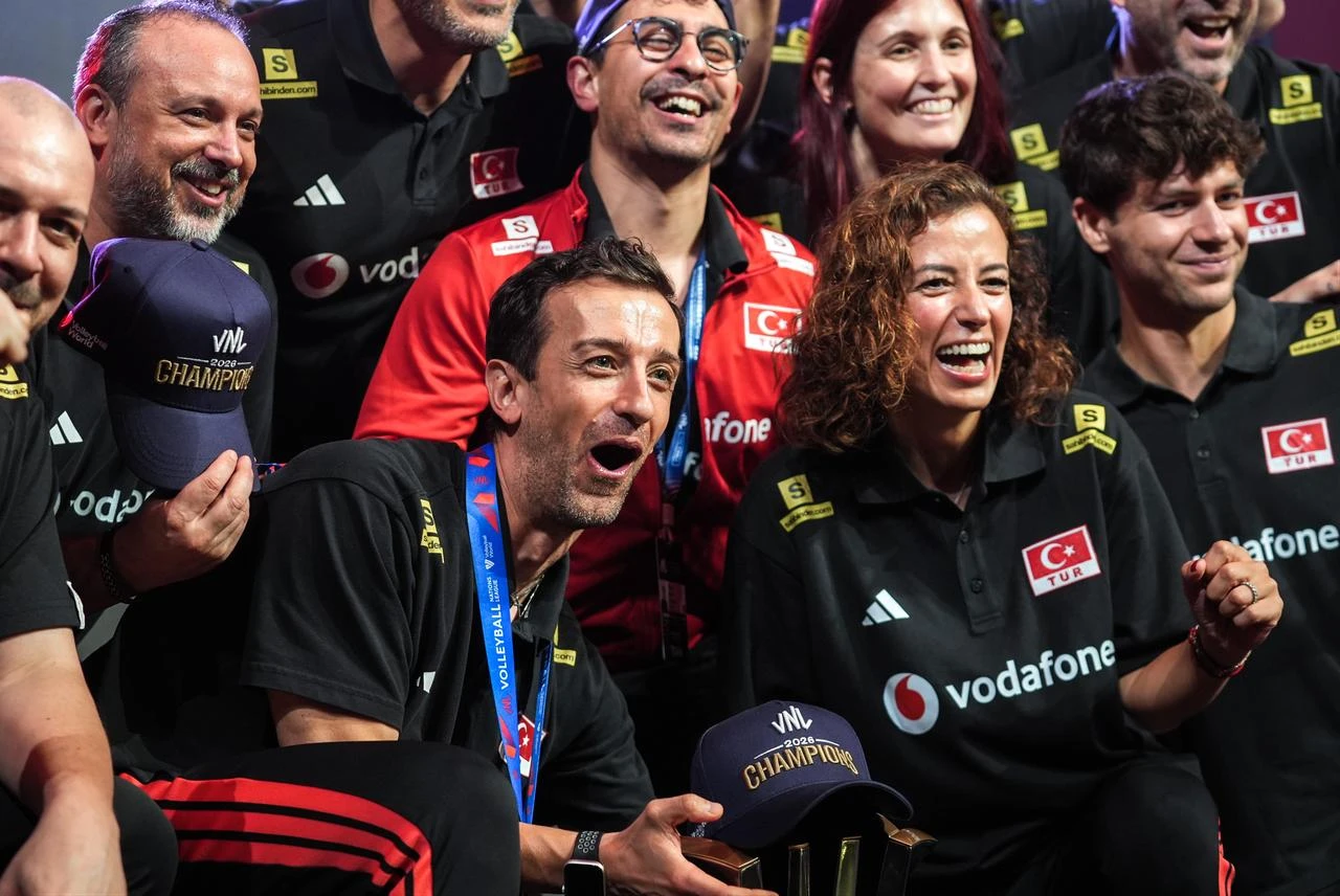 Head coach of Türkiye Daniele Santarelli celebrates with the trophy after winning the 2026 FIVB Volleyball Nations League (VNL) women's final match against Brazil at the East Asian Games Dome in Macao, China, on July 26, 2026. (AA Photo)