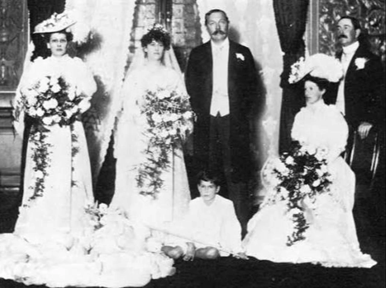 Sir Arthur Conan Doyle and Jean Leckie pictured with members of their wedding party in 1907. (Photo via The Arthur Conan Doyle Encyclopedia)