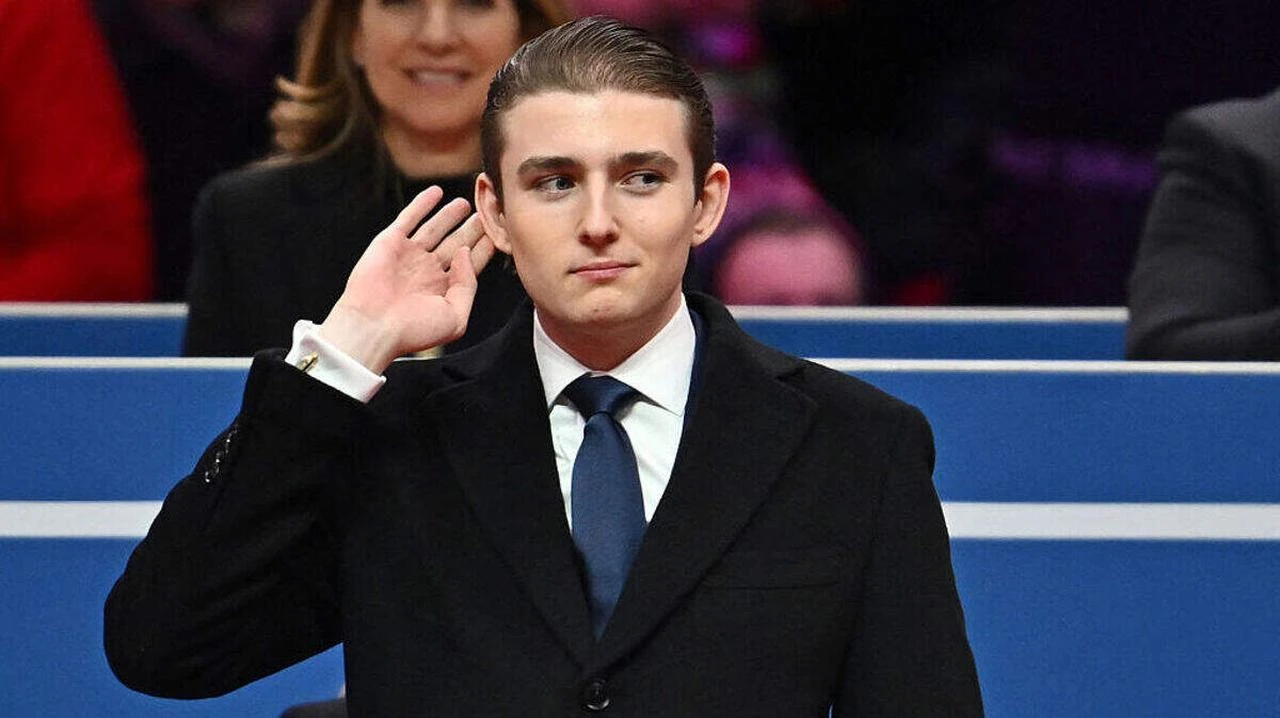Barron Trump gestures after being acknowledged by his father US President Donald Trump during the inaugural parade inside Capital One Arena, in Washington, DC, January 20, 2025. (AFP Photo)