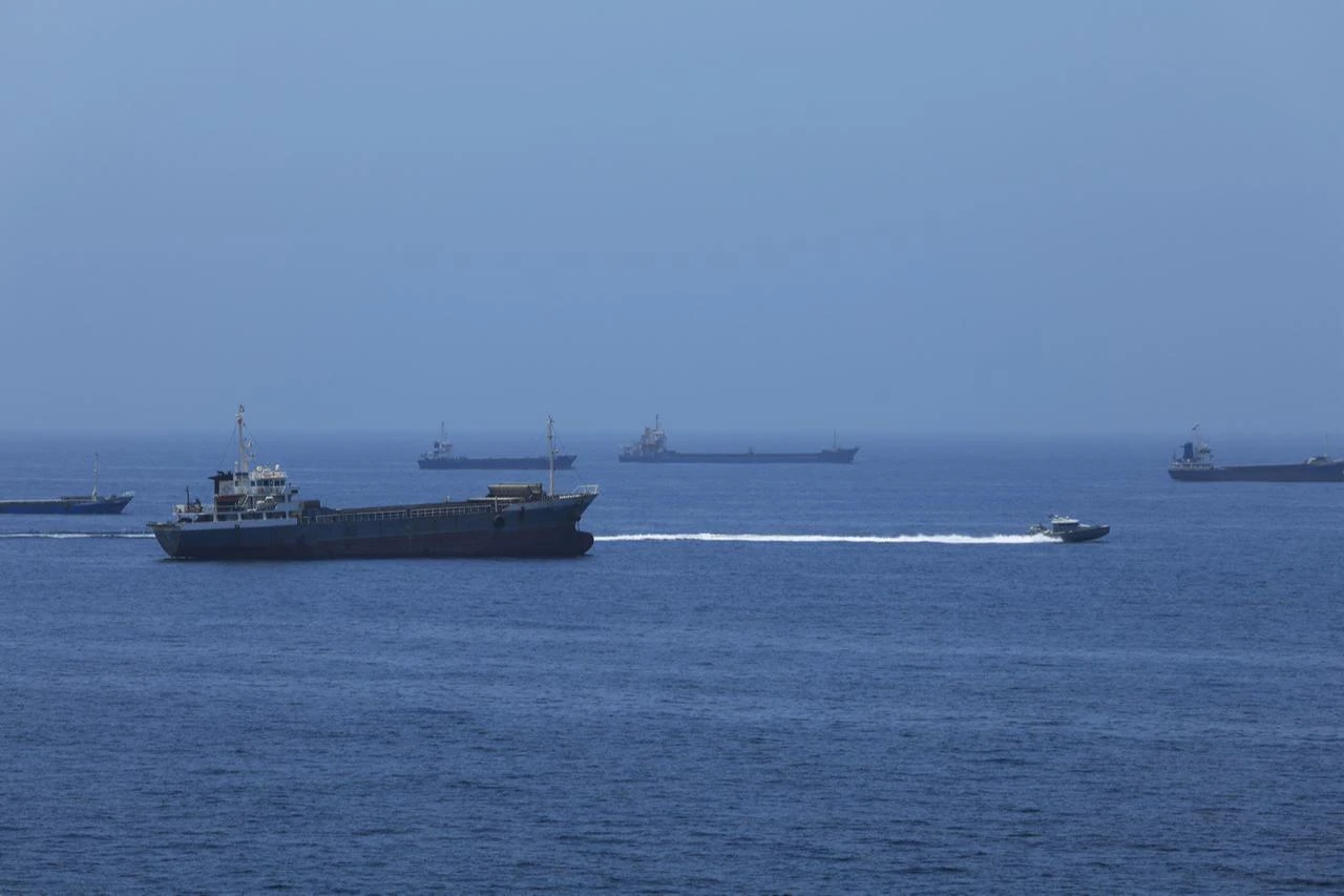 A view of commercial cargo vessels and crude oil tankers anchored in the Gulf of Oman, off the coast of Muscat, Oman, on June 21, 2026. (AA Photo)
