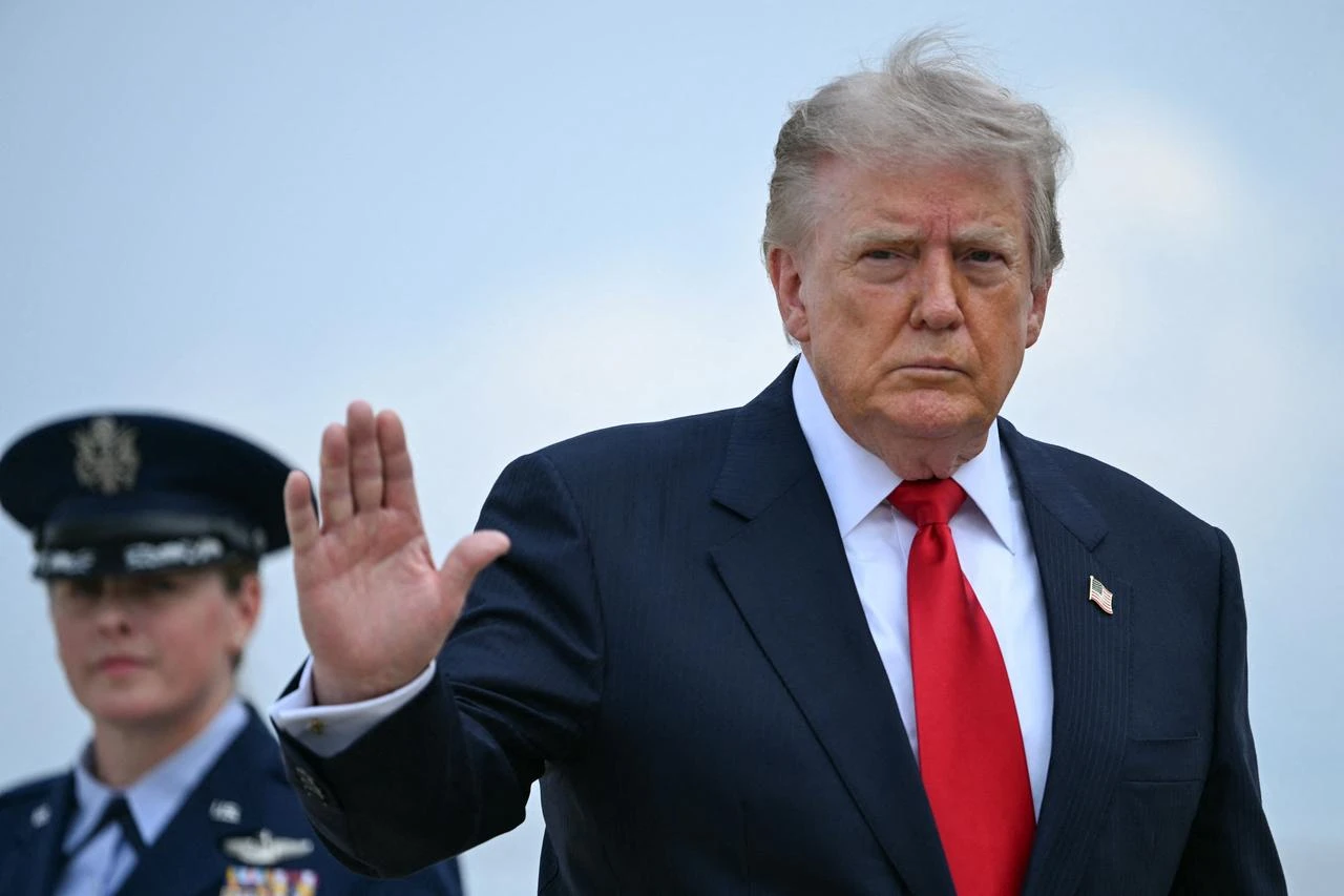 US President Donald Trump waves as he boards Air Force One at Joint Base Andrews, Maryland, July 27, 2026. (AFP Photo)