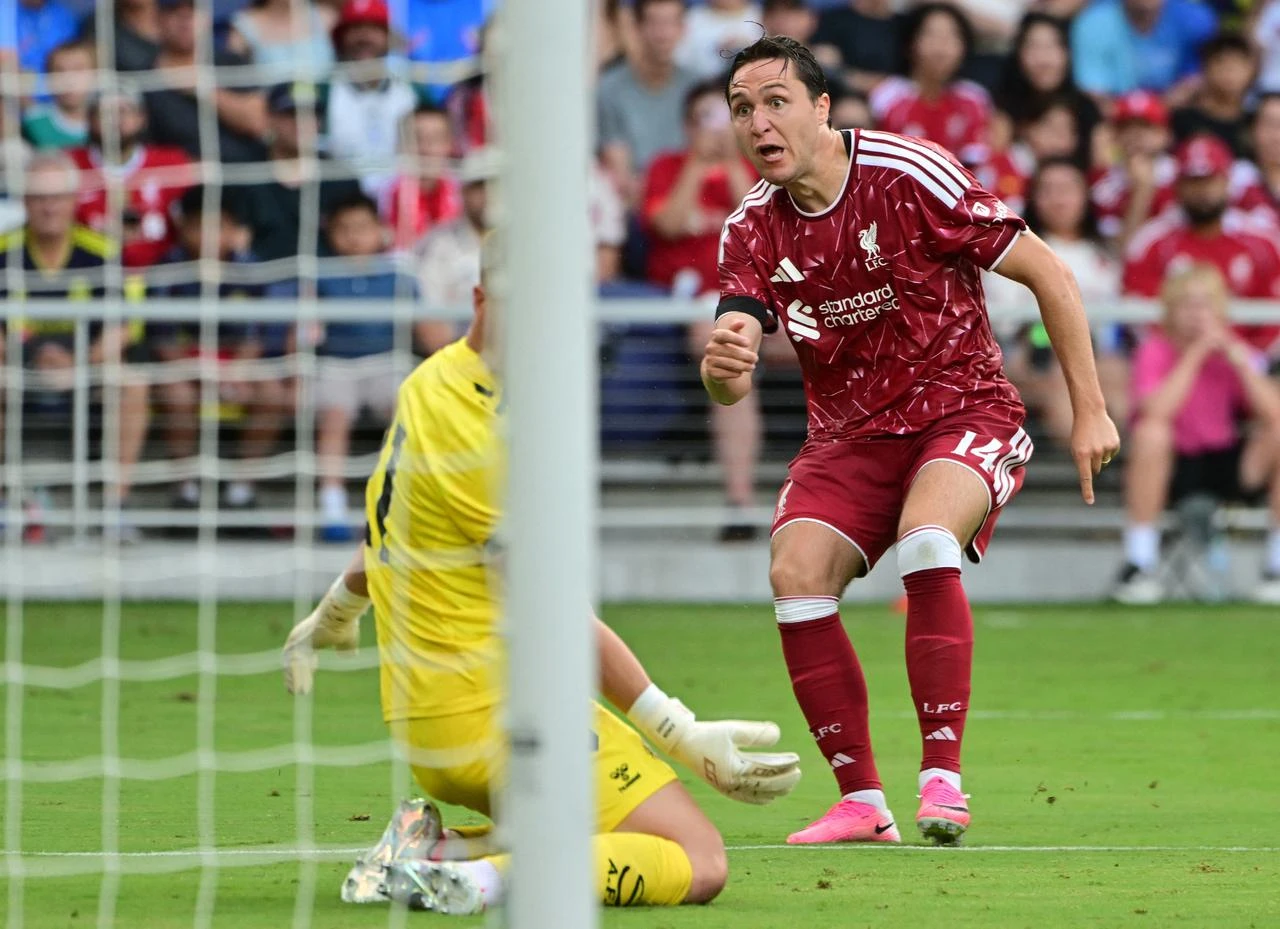 Liverpool's Italian striker #14 Federico Chiesa reacts as he scores his team's third goal past Sunderland's English goalkeeper #21 Simon Moore during the friendly football match between Liverpool and Sunderland at GEODIS Park in Nashville, Tennessee, on July 25, 2026. (AFP Photo)