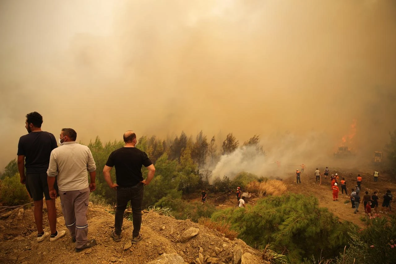Firefighting efforts continue by air and land to contain a forest fire that broke out in Seydikemer district of Mugla, Türkiye, on July 29, 2026. (AA Photo)