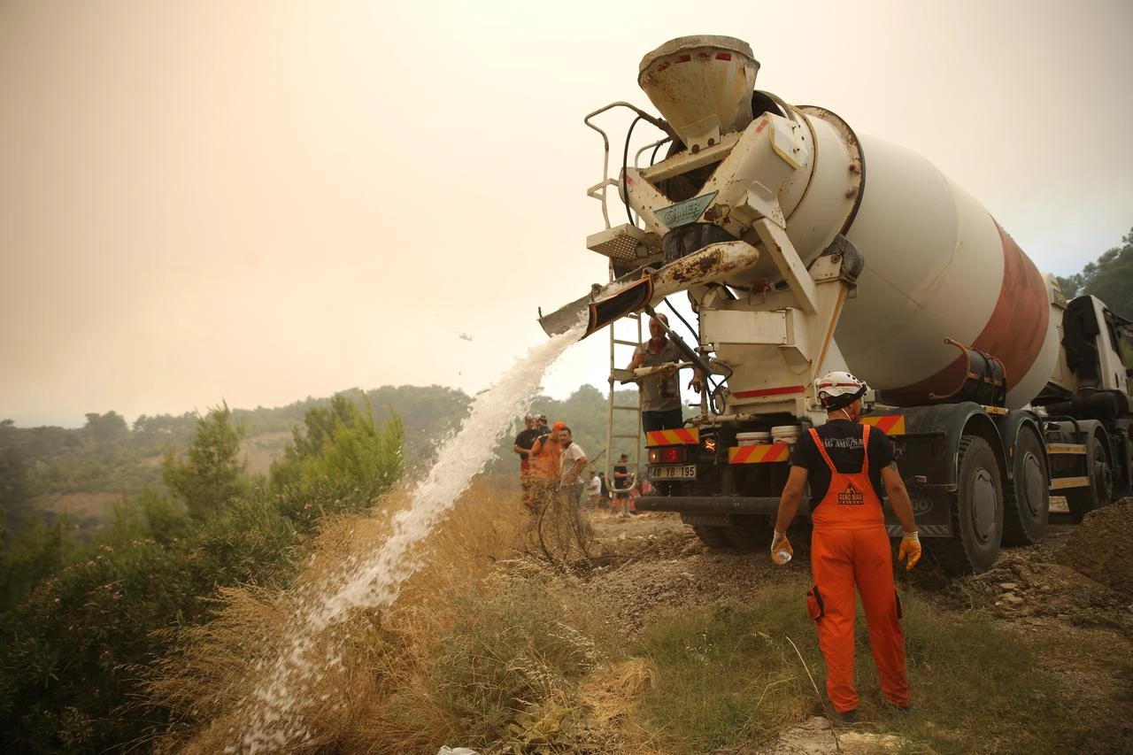 Firefighting efforts continue by air and land to contain a forest fire that broke out in Seydikemer district of Mugla, Türkiye, on July 29, 2026. (AA Photo)