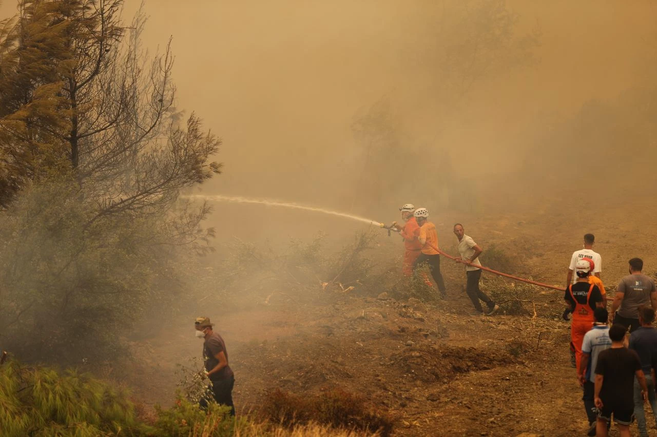 Firefighting efforts continue by air and land to contain a forest fire that broke out in Seydikemer district of Mugla, Türkiye, on July 29, 2026. (AA Photo)