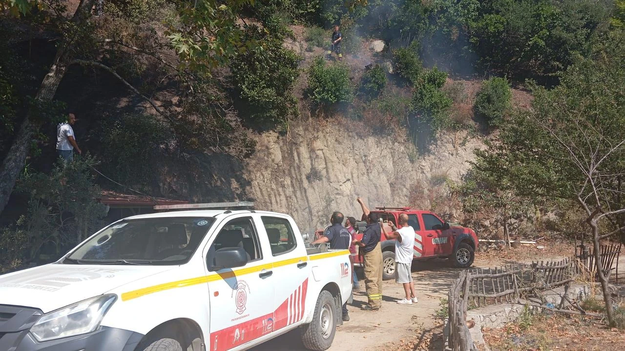 Firefighters and local residents respond to a fire in Balikesir, Türkiye, July 28, 2026. (AA Photo)