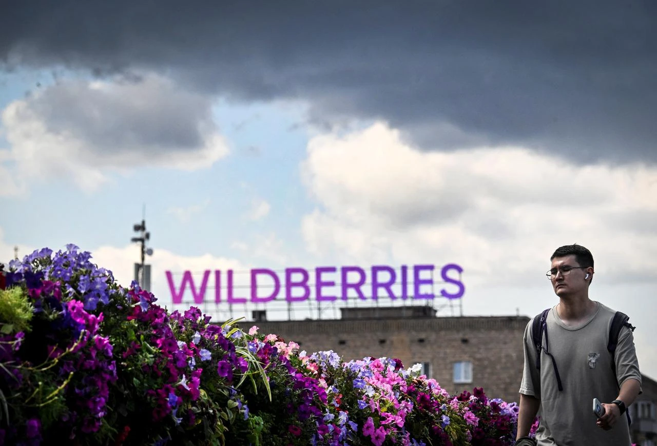 A man walks past Russian e-commerce giant Wildberries' logo in downtown Moscow, July 27, 2026. (AFP Photo)