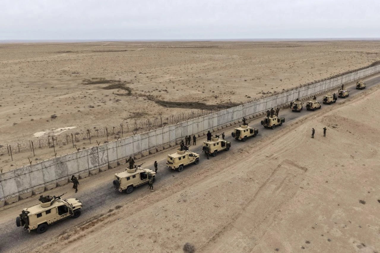 An aerial photograph shows members of the Popular Mobilization Forces deployed along the border with Syria in the Tarfawi area of northwestern Iraq, January 22, 2026. (AFP)
