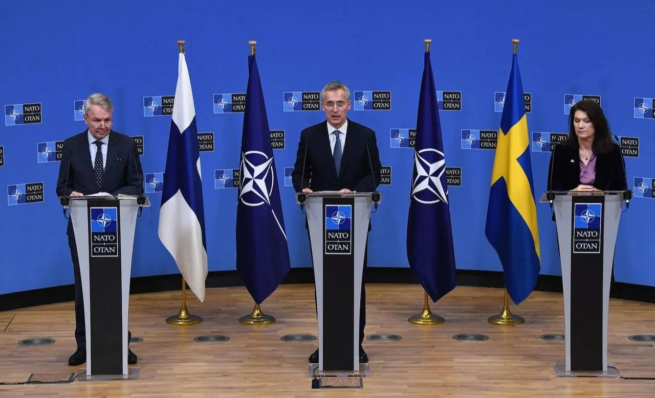 NATO Secretary-General Jens Stoltenberg, Finnish FM Pekka Haavisto, and Swedish FM Ann Linde speak at a press conference after their meeting at NATO headquarters in Brussels, Jan. 24. 2022. (AFP Photo)