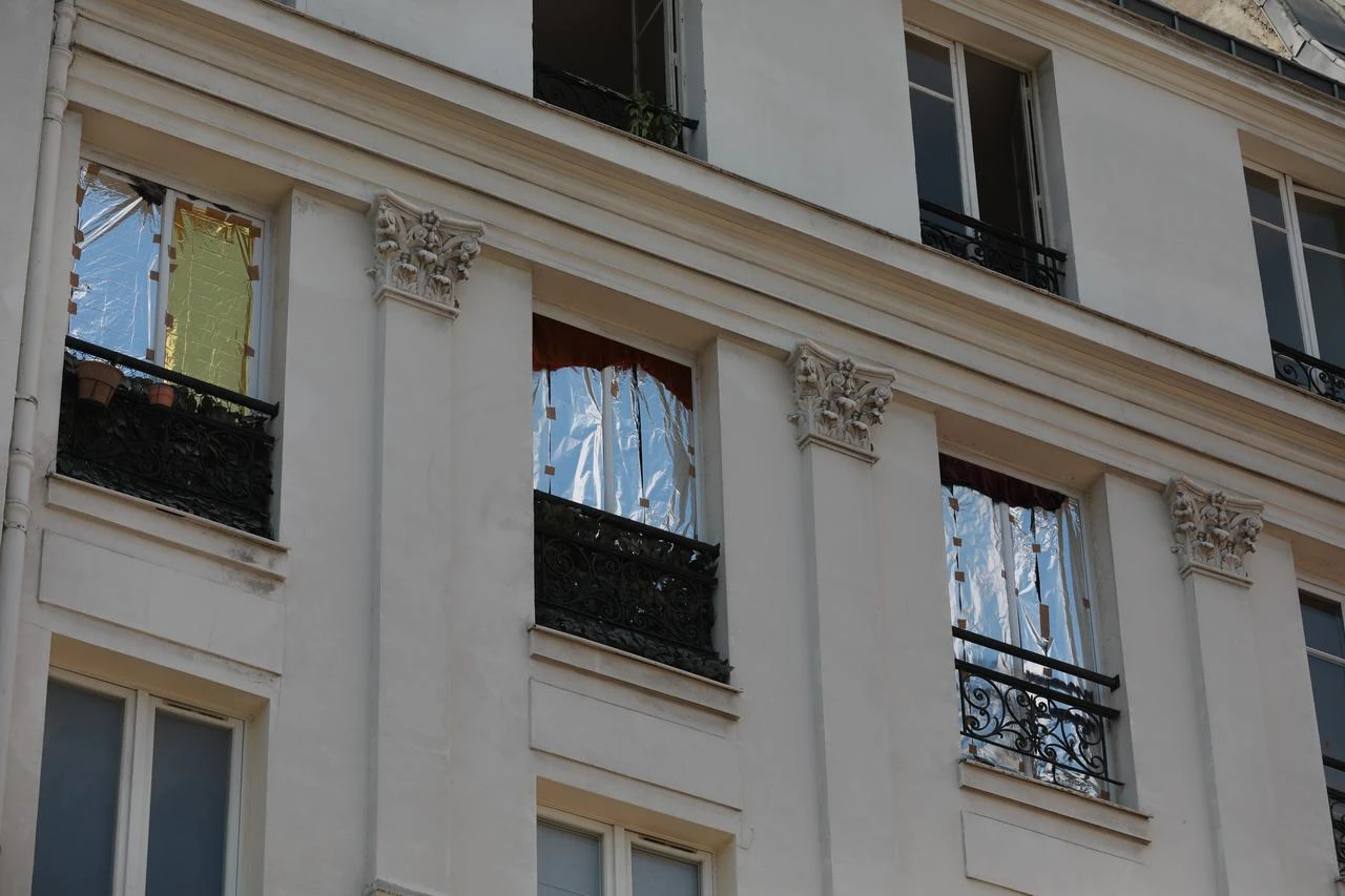 Some residents cover their apartment windows with aluminum foil to keep their homes cooler, particularly in older buildings with zinc roofs as residents sought relief from soaring temperatures in Paris, France, June 26, 2026. (AA Photo)