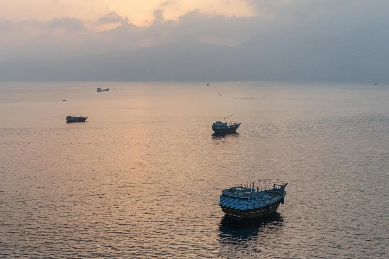 This aerial photograph shows boats anchored off Oman’s northern Musandam Peninsula near the Strait of Hormuz on June 27, 2026. (AFP Photo)