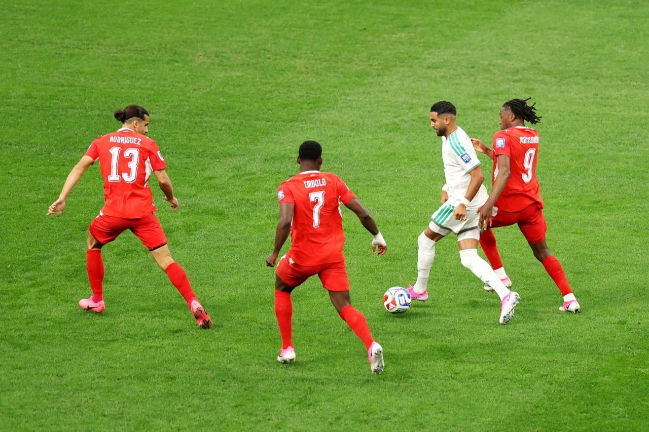 Riyad Mahrez #7 of Algeria controls the ball against Ricardo Rodriguez #13, Breel Embolo #7 and Johan Manzambi #9 of Switzerland during the FIFA World Cup 2026 Round of 32 match between Switzerland and Algeria at BC Place Vancouver in British Columbia, July 02, 2026. (AFP Photo)