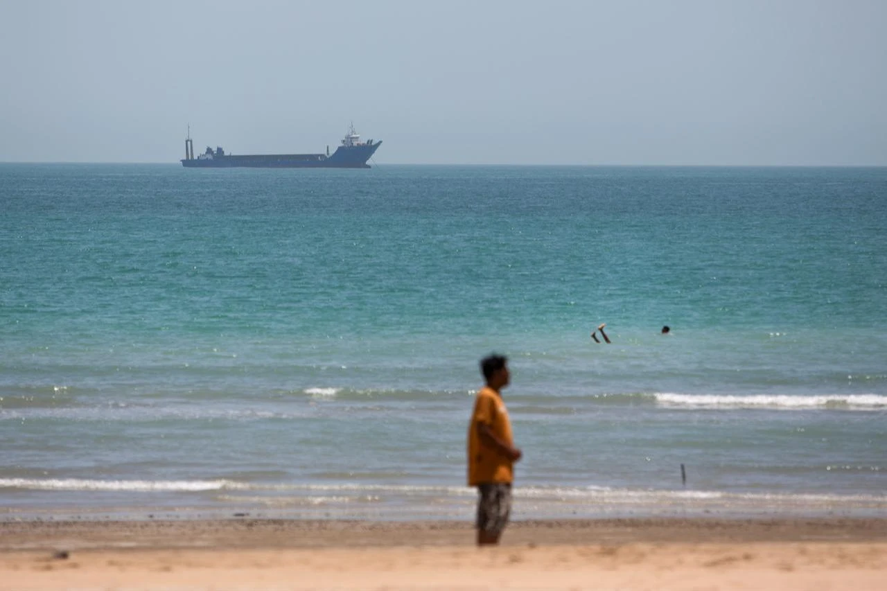 Iranian commercial ships are seen off the coast of Kong city in southern Iran on June 21, 2026. (AA Photo)