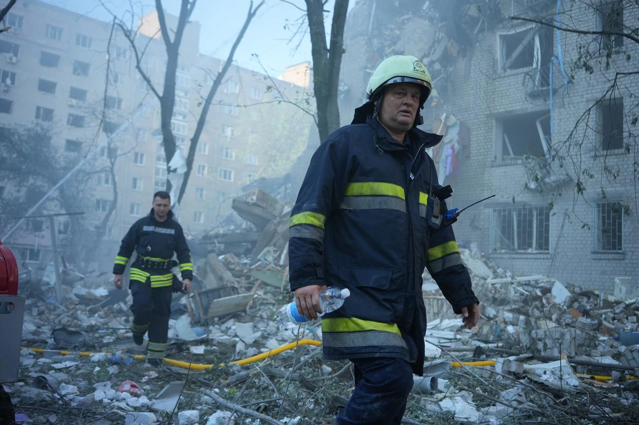 Search and rescue operations are ongoing at the sites damaged by a Russian strike, including a multi-story apartment building and several private homes in Kyiv's Darnytskyi district, Ukraine, on July 02, 2026. (AA Photo)